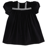 The Beaufort Bonnet Company’s Baby Girls’ and Girls’ Velveteen Dilly Dress features short puff sleeves, a gathered skirt, and white trim at the chest and neckline—an ideal black velvet pick for your holiday wardrobe.