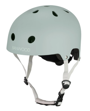The Banwood Eco Helmet is a matte light green classic-style helmet featuring ventilation holes, a chin strap, and "BANWOOD" printed on the side.