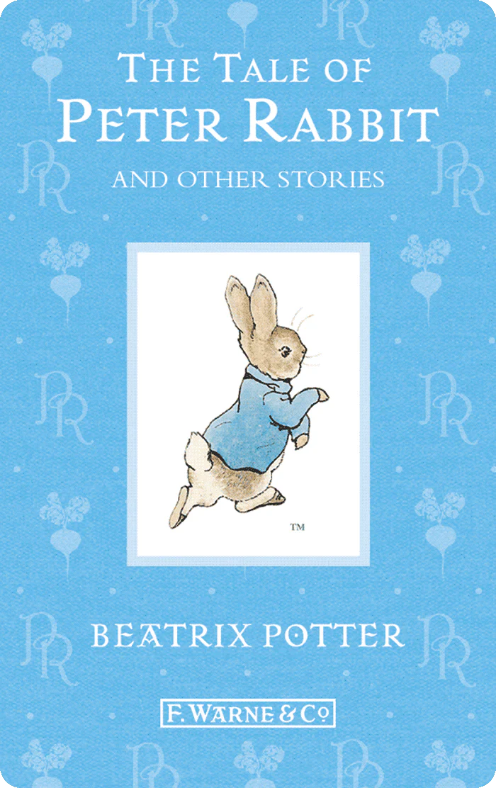 Cover of "Yoto Cards: Beatrix Potter: The Complete Tales" by Yoto showing an illustration of Peter Rabbit on a blue background with decorative elements.