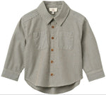 The Baby Boys’ and Boys’ Checkered Classic Shirt by Copenhagen Colors features long sleeves, 2 chest pockets, brown buttons, and a black-and-white small checkered pattern.