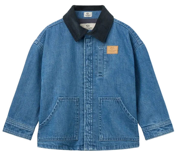 Copenhagen Colors Boys’ Denim Jacket with Corduroy Collar features a black collar, front zipper, two large pockets, and a tan patch on the left chest.