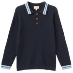 The Boys’ Knitted Waffle Polo Long-Sleeved Polo by Copenhagen Colors features navy blue knit, ribbed texture, button placket, and light blue and white striped collar and cuffs.