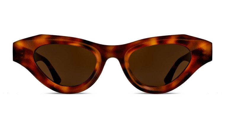 Thierry Lasry Jaya Sunglasses, part of Thierry Lasry's exclusive eyewear collection, feature dark tinted lenses for a chic look.