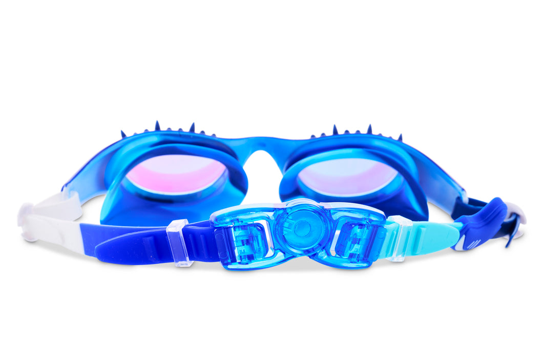 The Bling2O Kids' Shark Surge Goggles feature blue and white coloring, tinted lenses, and an adjustable strap, displayed on a white background.
