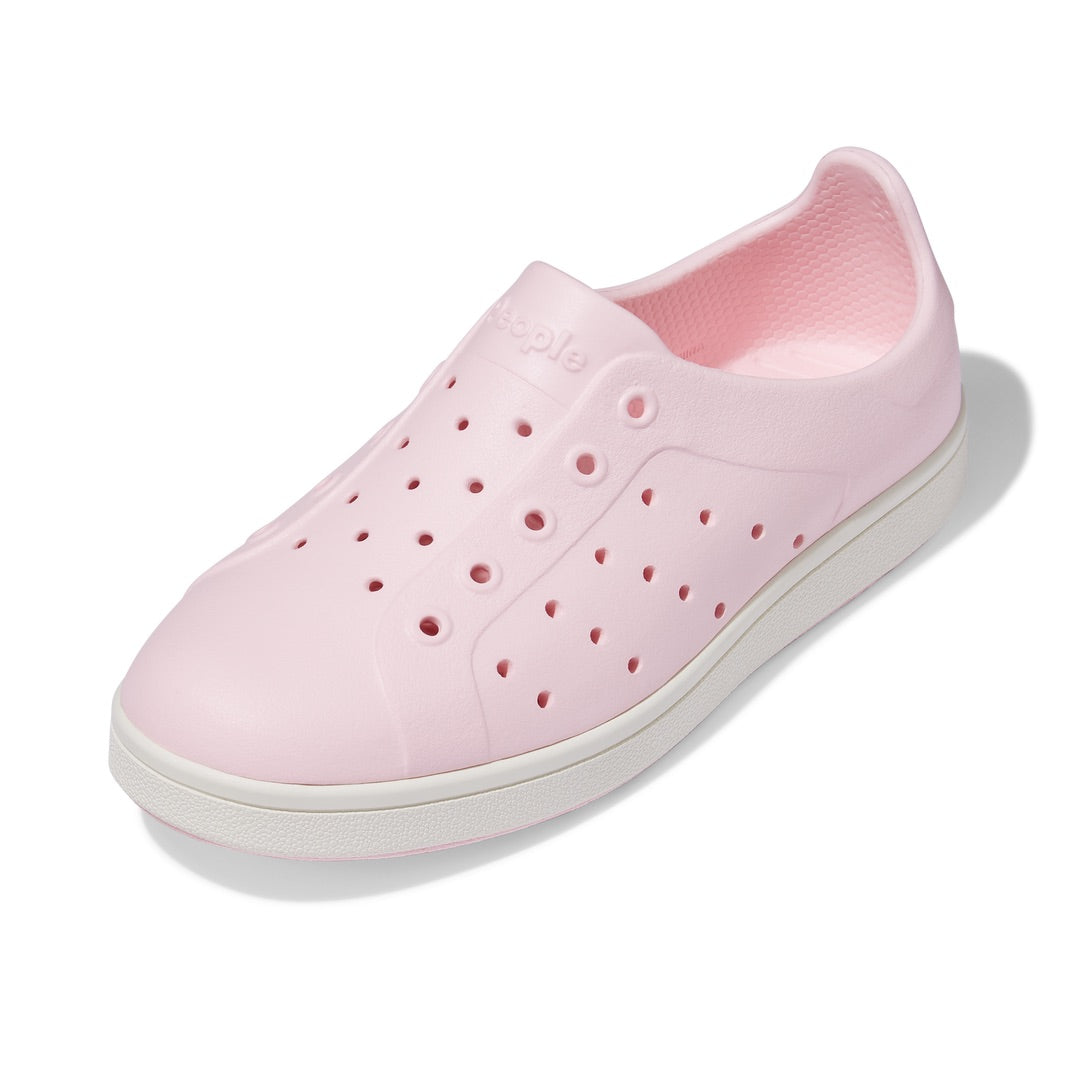 A pink People Footwear Ace Kids' Slip On shoe with breathable holes on the sole.