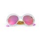 Bling2O Girls’ Glass Beach Sprinkle Sunrise Sunglasses feature child-size, round translucent frames with pink-tinted UV-protected lenses and a playful sprinkle-inspired design with colorful beads inside the frames.