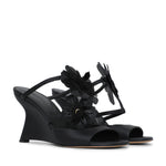 Black Zimmermann Belara Wedge sandals featuring a T-strap design and large floral appliqués.