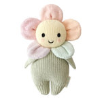 Cuddle + Kind’s Baby Daisy - Sunshower is a handcrafted knitted plush doll made from cotton yarn, featuring a smiling face, round black eyes, and five pastel petals encircling its head like a flower—perfect as a soft baby toy or cherished heirloom—shown against a white background.