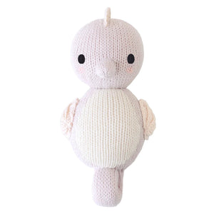 Hand-knit in soft Peruvian cotton, the Cuddle + Kind Baby Seahorse Lilac features gentle lilac coloring, round black eyes, small fins, and a curled tail—an heirloom-quality stuffed toy perfect for little ones.