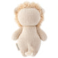The Baby Lion by Cuddle + Kind is an heirloom-quality knitted stuffed toy shown from the back, highlighting its soft beige yarn texture, fluffy mane, and small tail.