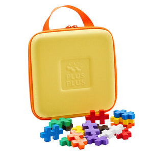 The Plus Plus BIG Travel Case by Plus Plus, featuring a yellow case with an orange handle and colorful puzzle pieces, is the perfect STEM toy for fun and learning on the go.