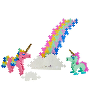 Plus Plus Learn To Build - Unicorns features two unicorn figures made from interlocking plastic pieces beside a rainbow-topped cloud—a STEM toy inspiring creativity and building fine motor skills.
