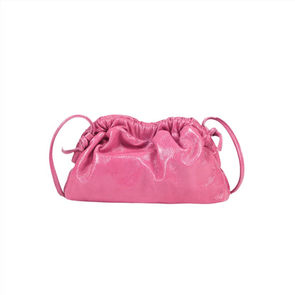 A Mansur Gavriel Mini Cloud Clutch in pink, featuring a shiny finish and two thin straps, expertly handcrafted in Italy from luxurious Italian lamb leather, displayed against a plain white background.