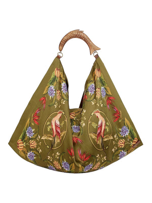 Farm Rio’s Satin Scarf Medium Bag features olive green fabric with floral and bird print, plus a sculpted fish-shaped wooden handle—a standout accessory for bold style and tropical flair lovers.
