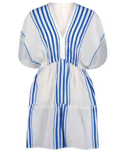 The Lemlem Alem Plunge Dress is a short white dress with blue vertical stripes and a V-neckline made from hand-woven cotton. The dress features short sleeves, an elastic waist, and is perfect for resort wear.