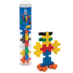 The Plus Plus Tube - BIG 15 Piece - Basic is displayed next to a colorful assembled figure, showing how these building blocks offer creative play and help develop fine motor skills.