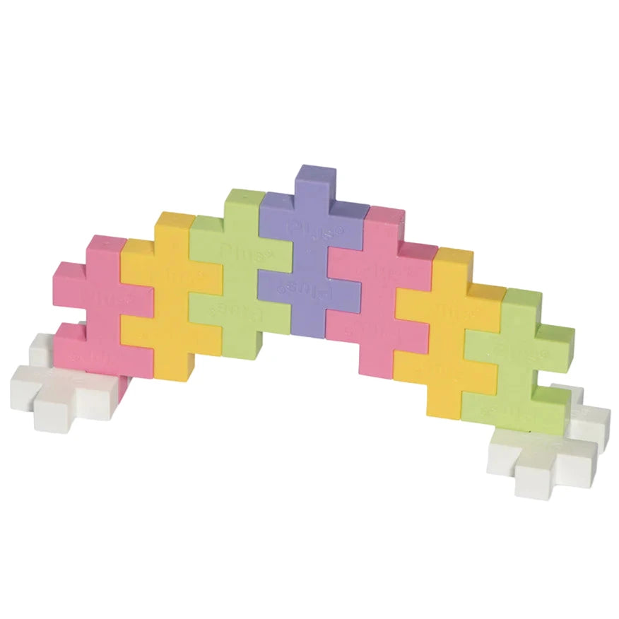 The Plus Plus Tube - BIG 15 Piece - Pastel features interlocking puzzle blocks in soft pastel colors, encouraging creative play and fine motor skill development, all displayed on a white background.