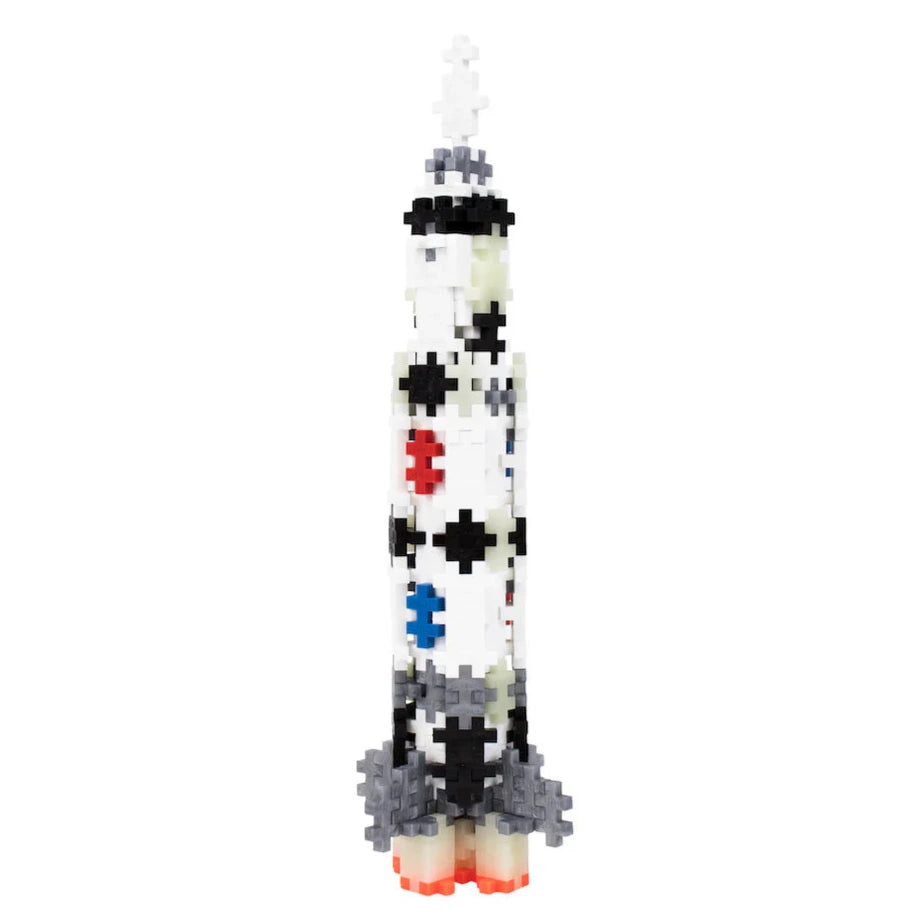 The Plus Plus Tube - 240 Piece - Saturn V Rocket features interlocking plastic pieces in multiple colors, standing upright—ideal for creative play that develops fine motor skills.