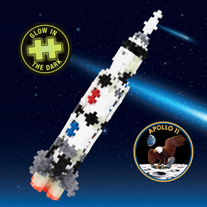 The Plus Plus Tube - 240 Piece - Saturn V Rocket is a STEM toy that inspires creative play and develops fine motor skills, featuring glow-in-the-dark mission badges and a starry background for imaginative Apollo 11 adventures.