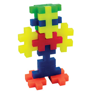 The Plus Plus Tube - BIG 15 Piece - Neon features interlocking blocks in vibrant neon colors, designed for creative play and to help develop fine motor skills—perfect for building imaginative figures.
