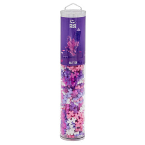 The Plus-Plus Tube - 240 Piece - Glitter Mix features glittery pink, purple, white, and blue building blocks—ideal for creative play and developing fine motor skills.