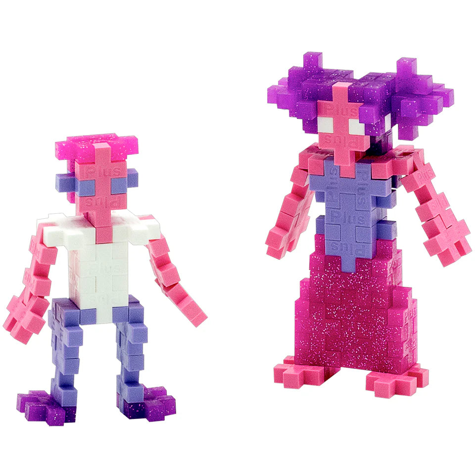 Two colorful humanoid figures built from Plus Plus’s Tube - 240 Piece - Glitter Mix, one smaller in pink, white, and purple, the other larger in purple and pink with glittery pieces—an ideal STEM toy that sparks creativity and fine motor skills.