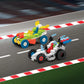 Two colorful toy race cars built from Plus Plus Learn to Build - Vehicles interlocking bricks are shown on a racetrack with a red and white curb.