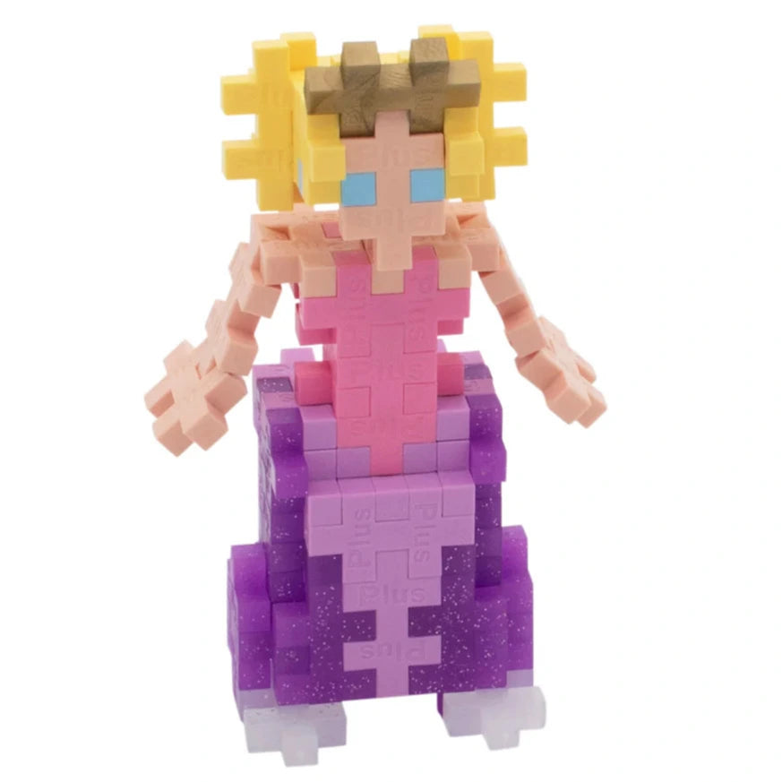 The Plus Plus Tube - Princess features a pixelated princess with yellow hair, a pink top, and a purple skirt, made from interlocking plastic blocks—ideal for creative play and developing fine motor skills.