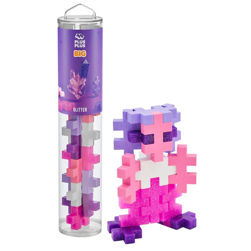 The Plus Plus BIG 15 Piece Tube - Glitter includes pink, purple, and white glitter blocks. Build sparkling 3-D figures with this creative set—great for adding to your Plus Plus collection!.