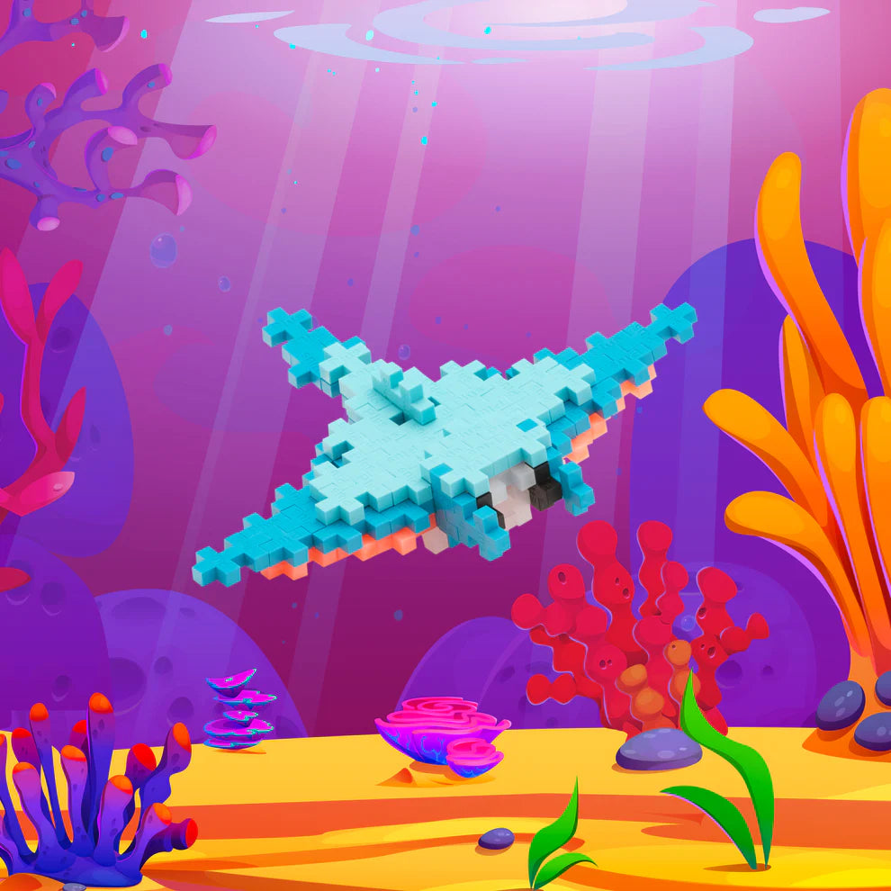 The Plus Plus Tube - Manta Ray lets kids build a pixelated aquatic animal swimming among colorful corals and plants, inspiring creativity and developing fine motor skills—an ideal STEM toy for imaginative play.