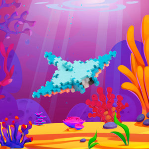 The Plus Plus Tube - Manta Ray lets kids build a pixelated aquatic animal swimming among colorful corals and plants, inspiring creativity and developing fine motor skills—an ideal STEM toy for imaginative play.