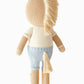 Liam the Pony - Regular 20" by Cuddle + Kind is a charming stuffed plush toy, viewed from the back, featuring a beige body, blue pants, tan yarn mane and tail, and light brown arms and legs—a delightful friendship plush that's perfect as a birthday gift for someone special.