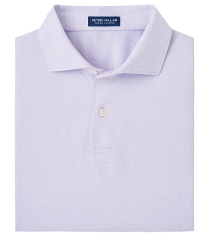 The folded Albatross Cotton Blend Piqué Polo by Peter Millar comes in light lavender, featuring a collar and two buttons, with a visible tag inside the collar.