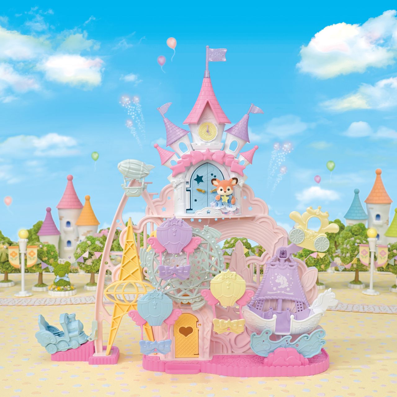 Experience the whimsical Calico Critters Baby Dream Amusement Park, an outdoor playset featuring a vibrant Ferris wheel, festive flags, and adorable animal figures, all set against pastel castle buildings, cheerful balloons, and leafy trees beneath a blue sky dotted with clouds.