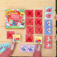 Two children play Eeboo’s Little Farm Pre-School Matching Game at a wooden table, challenging their minds with cards featuring animals and vehicles. The game’s box is also on the table, making this engaging memory game for kids a perfect choice for learning and play.