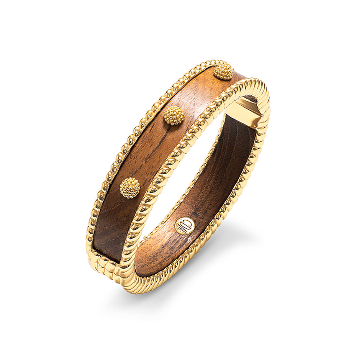 The Berry Small Hinged Bangle by Juliska Capucine De Wulf features beaded edging and raised gold accents, shown on a white background—ideal for stacking in your golden jewelry collection.