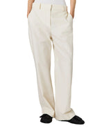 A person wearing Stella McCartney Washed Cotton Straight Trousers with hands in pockets and black loafers, shown from the waist down against a plain background.