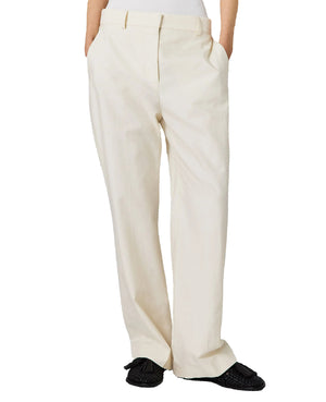 A person wearing Stella McCartney Washed Cotton Straight Trousers with hands in pockets and black loafers, shown from the waist down against a plain background.