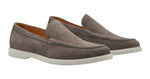 The Peter Millar Excursionist Venetian Loafer by Peter Millar is a pair of men's leather loafers crafted from water-resistant gray suede, featuring white rubber soles, visible stitching, and a slip-on design for lightweight versatility.