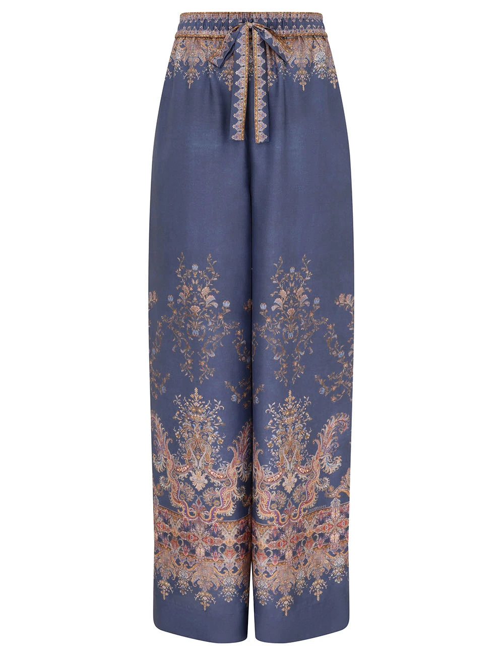 The Zimmermann Valiant Track Pant is a wide-leg, high-rise silk pant with floral and paisley print, drawstring waistband, and elastic front tie in classic navy.
