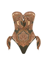 Zimmermann Mahon Scarf Tie One Piece features a strapless olive paisley print, front keyhole cutout, and side tie details, shown on a plain white background.
