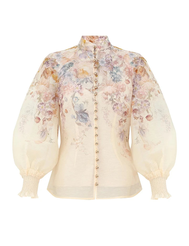 Zimmermann Ascent Blouse: sheer, long-sleeve, pastel floral print with high neck, fabric-covered buttons, and gathered cuffs.
