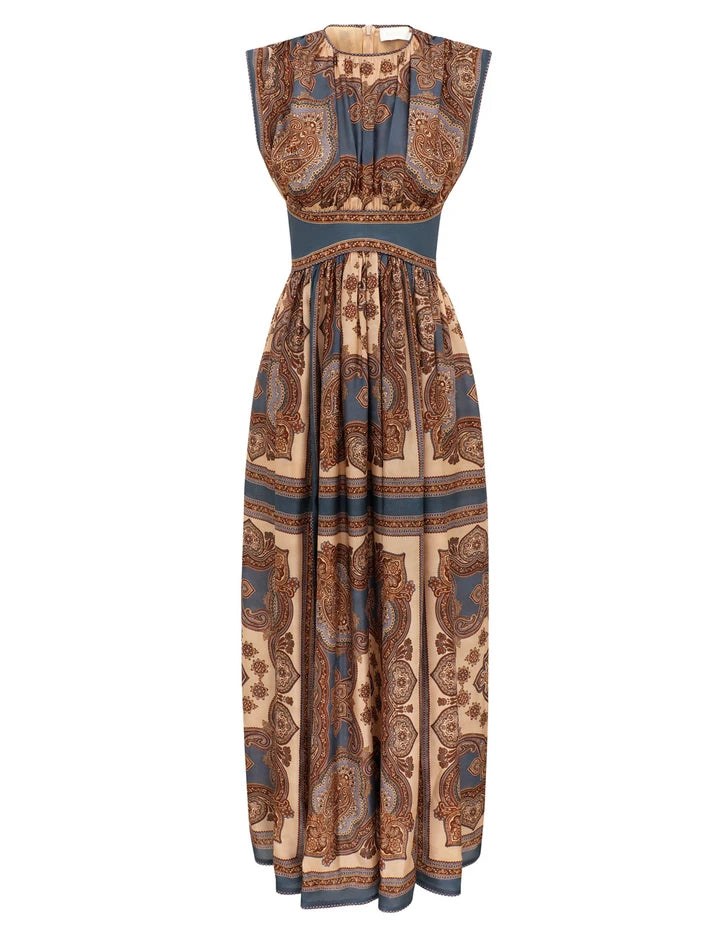 The Mahon Waisted Maxi Dress by Zimmermann features a dark blue paisley print on beige silk habutae, adding effortless elegance to your style.