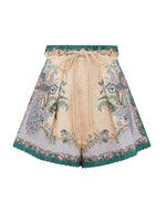 Zimmermann Indra Tuck Short: high-waisted linen with peacock/floral print, lace-up front ties, flared silhouette, and green trim—ideal for Summer Swim 2026.