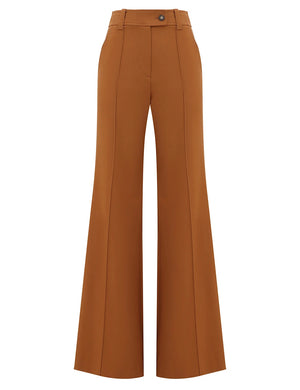 The Valiant Wool Flare Pant by Zimmermann is a high-waisted, wide-leg brown wool pant with front seams, single button waist, and flared hem on a white background.