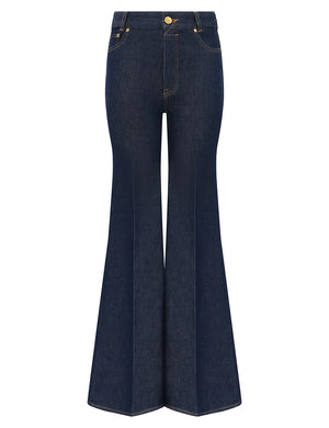 Zimmermann Slim Flare Jean in Harbour Blue denim with high waist, front and back pockets, and yellow stitching, shown on a white background.