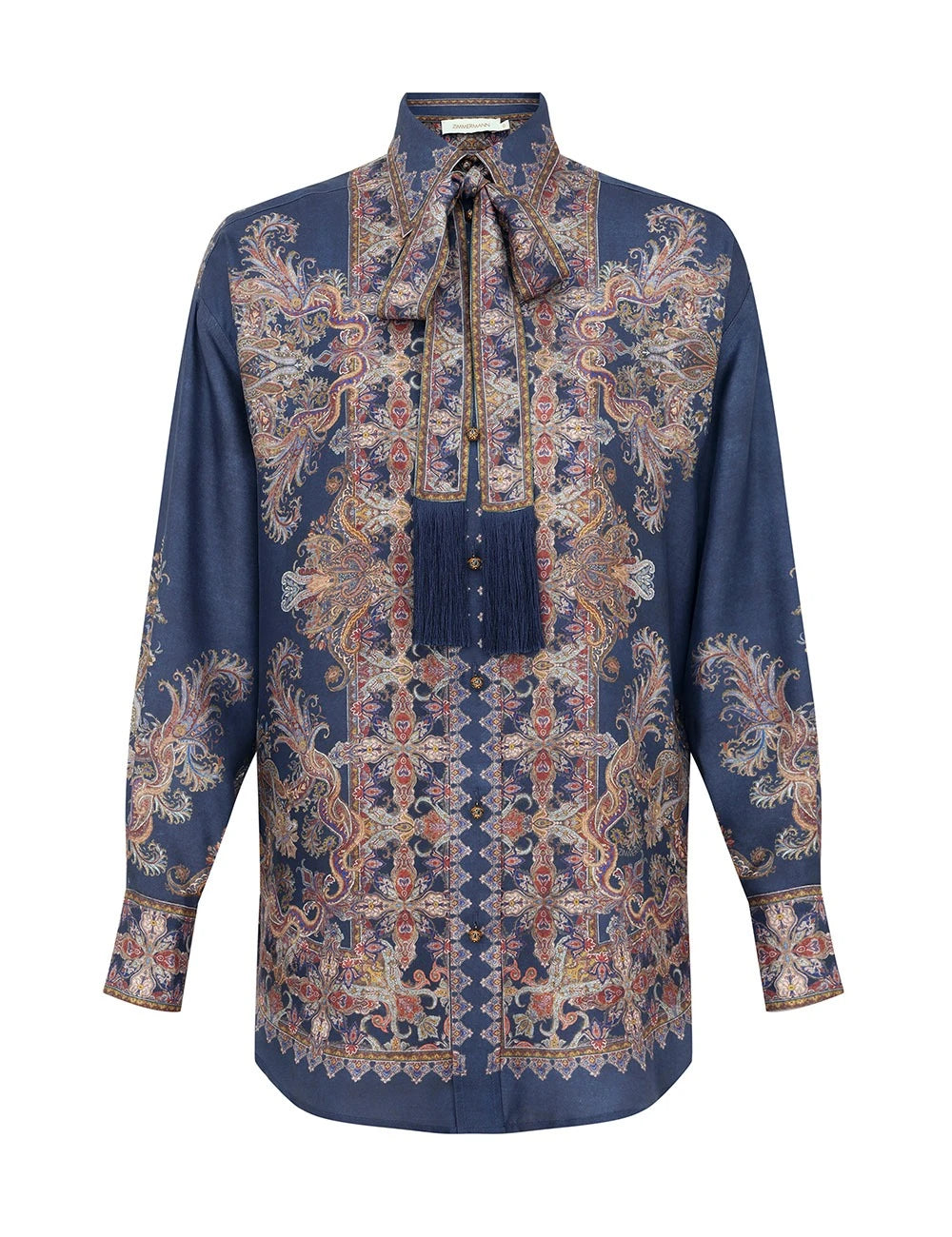 The Valiant Relaxed Shirt by Zimmermann features long sleeves, a navy paisley base with floral patterns, and a matching tassel necktie.