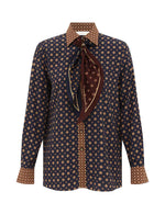 Zimmermann Relaxed Multi Geo Print Shirt: long sleeves, navy & tan geo print, tan polka-dot cuffs/collar, brown patterned neck scarf. Fall 2026 Collection.