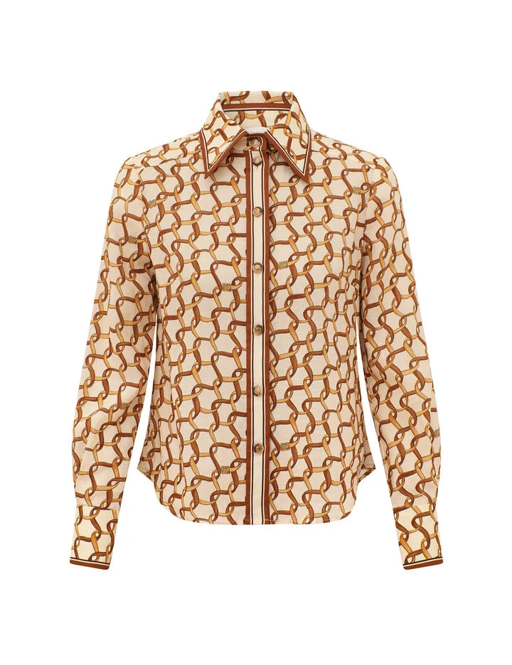 The Fitted Cream Ribbon Shirt by Zimmermann features a long-sleeve cream design with brown chain-link print, button-down front, pointed collar, and brown-trimmed edges.