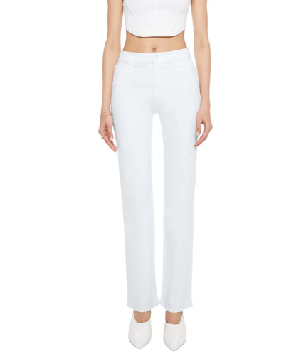 A person is wearing the Mother Kick It high-rise straight-leg jeans in a light blue wash, styled with a white crop top and white pointed shoes, standing facing forward against a plain background.